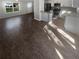 Spacious open floor plan showcasing new floors and ample natural light, connecting living and kitchen spaces at 4665 Garden Hills Dr, Stone Mountain, GA 30083