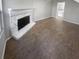 Spacious living room features a stone fireplace and durable flooring at 4665 Garden Hills Dr, Stone Mountain, GA 30083