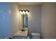 Bathroom featuring a single sink vanity and a toilet with neutral wall color at 98 Brenda Cir, Rockmart, GA 30153