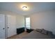Bedroom featuring a bed, dresser, carpeted floors, and a window with natural light at 98 Brenda Cir, Rockmart, GA 30153