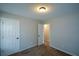 Cozy bedroom featuring neutral paint, carpeted floor, and overhead lighting at 98 Brenda Cir, Rockmart, GA 30153