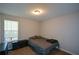 Bedroom showcasing a bed, dresser, carpeted floors, and a window with natural light at 98 Brenda Cir, Rockmart, GA 30153