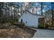 Side view of a home featuring a small deck, an American flag, and a driveway at 98 Brenda Cir, Rockmart, GA 30153