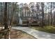 Inviting home featuring a spacious driveway leading to a cozy cottage-style retreat at 98 Brenda Cir, Rockmart, GA 30153