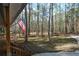 Expansive front yard with mature trees and lush greenery create a serene setting at 98 Brenda Cir, Rockmart, GA 30153