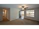 Comfortable living room with neutral carpeting, ceiling fan, and an open doorway to outside at 98 Brenda Cir, Rockmart, GA 30153