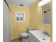 Clean, bright bathroom with white fixtures, including a toilet, sink, and shower with a curtain at 2655 Lakeside Trl, Cumming, GA 30041