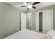 Cozy bedroom with a ceiling fan and double closets at 2655 Lakeside Trl, Cumming, GA 30041