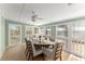 Enclosed porch dining room with natural light and comfortable seating at 2655 Lakeside Trl, Cumming, GA 30041