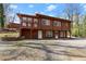 Two-story home with natural landscaping, offering inviting entrance at 2655 Lakeside Trl, Cumming, GA 30041