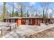 Inviting front exterior featuring gravel pathway and relaxing patio at 2655 Lakeside Trl, Cumming, GA 30041