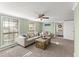 Bright living room with large window, carpeted floors, and a cozy seating arrangement at 2655 Lakeside Trl, Cumming, GA 30041