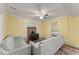 Cozy living room with neutral sofas, a brick fireplace, and a view to a bedroom at 2655 Lakeside Trl, Cumming, GA 30041