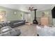 Cozy living room with gray sofa, carpeted floors, and brick fireplace at 2655 Lakeside Trl, Cumming, GA 30041