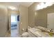 Bathroom boasts granite counters, a sleek sink, and access to the adjacent main bedroom at 4805 W Village Se Way # 1302, Smyrna, GA 30080