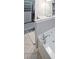 Bathroom featuring a soaking tub with granite counters and closet access at 4805 W Village Se Way # 1302, Smyrna, GA 30080