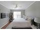 This bedroom features a large window and a cozy bed with side tables and lamps at 4805 W Village Se Way # 1302, Smyrna, GA 30080