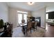 Dining area featuring a fireplace and access to a living space, perfect for entertaining at 4805 W Village Se Way # 1302, Smyrna, GA 30080