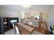 Bright dining room and kitchen boasts an island with granite countertops and stainless steel appliances at 4805 W Village Se Way # 1302, Smyrna, GA 30080
