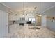 The white kitchen features granite countertops, subway tile backsplash, and stainless steel appliances at 4805 W Village Se Way # 1302, Smyrna, GA 30080