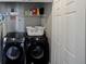 Convenient laundry room featuring modern, front load washer and dryer, plus storage shelf at 4805 W Village Se Way # 1302, Smyrna, GA 30080