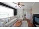Bright living room featuring a large window, comfortable sectional sofa and an attractive oval wall decor at 4805 W Village Se Way # 1302, Smyrna, GA 30080