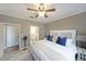 The main bedroom features carpet floors, a ceiling fan, and an ensuite bathroom at 4805 W Village Se Way # 1302, Smyrna, GA 30080