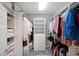 Spacious walk-in closet with custom shelving and ample hanging space for organized storage at 4805 W Village Se Way # 1302, Smyrna, GA 30080