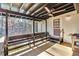 Relaxing back porch with wooded view, outdoor seating, and ceiling fan at 6828 Lockridge Dr, Atlanta, GA 30360