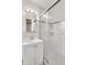 Bright bathroom featuring tile flooring, sink, vanity and textured glass shower at 6828 Lockridge Dr, Atlanta, GA 30360