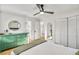 Spacious bedroom with hardwood floors, ceiling fan, closet and mint green dresser at 6828 Lockridge Dr, Atlanta, GA 30360