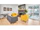 Cozy living room featuring a black brick fireplace and natural light at 6828 Lockridge Dr, Atlanta, GA 30360