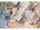 Aerial close-up of the property, showing the roof, driveway, parking area, and surrounding trees at 812 Bonnie Glen Se Dr, Marietta, GA 30067
