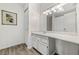 Bathroom featuring a sink with white cabinets and vanity counter with an adjoining closet at 812 Bonnie Glen Se Dr, Marietta, GA 30067