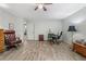 Comfortable bedroom featuring wood floors, and a ceiling fan; ideal for relaxation or home office use at 812 Bonnie Glen Se Dr, Marietta, GA 30067
