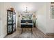 Dining area featuring wood floors, display case, modern lighting, and large window with a view at 812 Bonnie Glen Se Dr, Marietta, GA 30067
