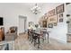 Dining room has wood floors, high ceilings, large table, and an eclectic gallery wall at 812 Bonnie Glen Se Dr, Marietta, GA 30067