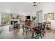 Open floorplan with dining area leading into the living room with a stone fireplace and large windows at 812 Bonnie Glen Se Dr, Marietta, GA 30067