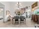 Bright dining room featuring hardwood floors, large table, unique decor, and chandelier lighting at 812 Bonnie Glen Se Dr, Marietta, GA 30067