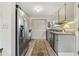 Kitchen featuring granite countertops, stainless steel appliances, wood-look floors, and plenty of cabinet space at 812 Bonnie Glen Se Dr, Marietta, GA 30067