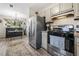 Kitchen with stainless steel appliances, breakfast area, light-colored cabinets, and a large window at 812 Bonnie Glen Se Dr, Marietta, GA 30067
