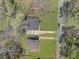 Aerial view of two homes with mature landscaping and tree coverage near a quiet neighborhood at 1883 Clarke Ln, Decatur, GA 30035
