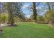 Spacious backyard with lush green grass and mature trees, creating a private outdoor space at 1883 Clarke Ln, Decatur, GA 30035