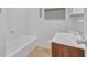 Full bathroom features a tub, toilet and a sink at 1883 Clarke Ln, Decatur, GA 30035