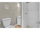 Full bathroom features tiled shower, toilet and white vanity at 1883 Clarke Ln, Decatur, GA 30035
