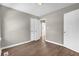 Bedroom with laminate flooring, neutral walls and a closet at 1883 Clarke Ln, Decatur, GA 30035