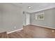 Neutral bedroom with wood-look floors, natural light, and closet at 1883 Clarke Ln, Decatur, GA 30035