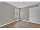 Light-filled bedroom features laminate flooring and a closet at 1883 Clarke Ln, Decatur, GA 30035