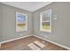 This bedroom features two windows and wood floors at 1883 Clarke Ln, Decatur, GA 30035