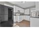 This modern kitchen features updated white cabinets and plenty of natural light at 1883 Clarke Ln, Decatur, GA 30035